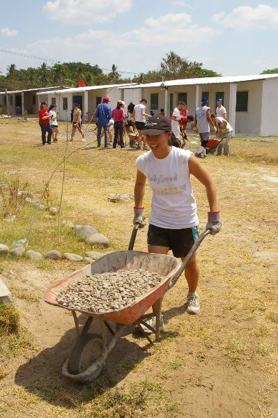 A Fuller Center volunteer helping build a home in El Salvador