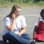 volunteer sitting, teaching student, playing games outside    